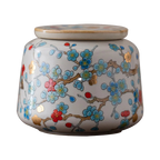 Boîte à thé japonaise en céramique avec motifs floraux dorés – Route du Thé