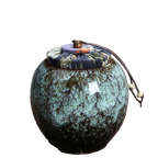 Contenant à thé en céramique vert, style artisanal – Route du Thé