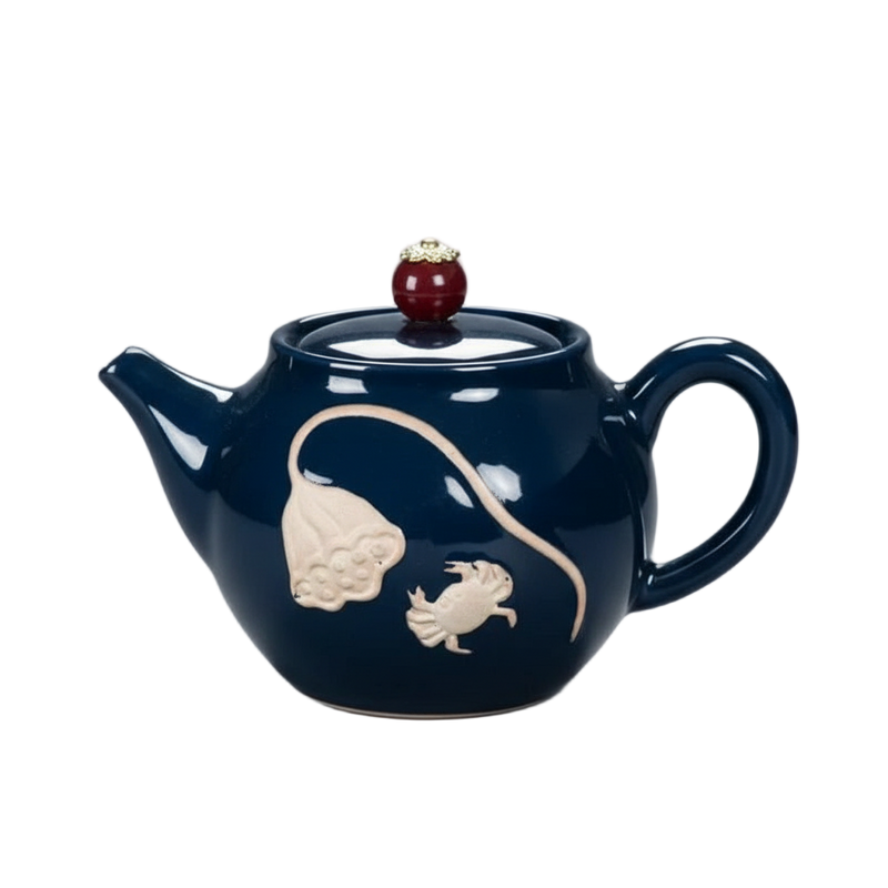 Théière chinoise en porcelaine émaillée sculptée bleu nuit, 270 ml, avec motifs en relief et couvercle décoratif.