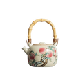 Théière chinoise en porcelaine avec motifs de pêches et poignée en bambou, 210 ml.